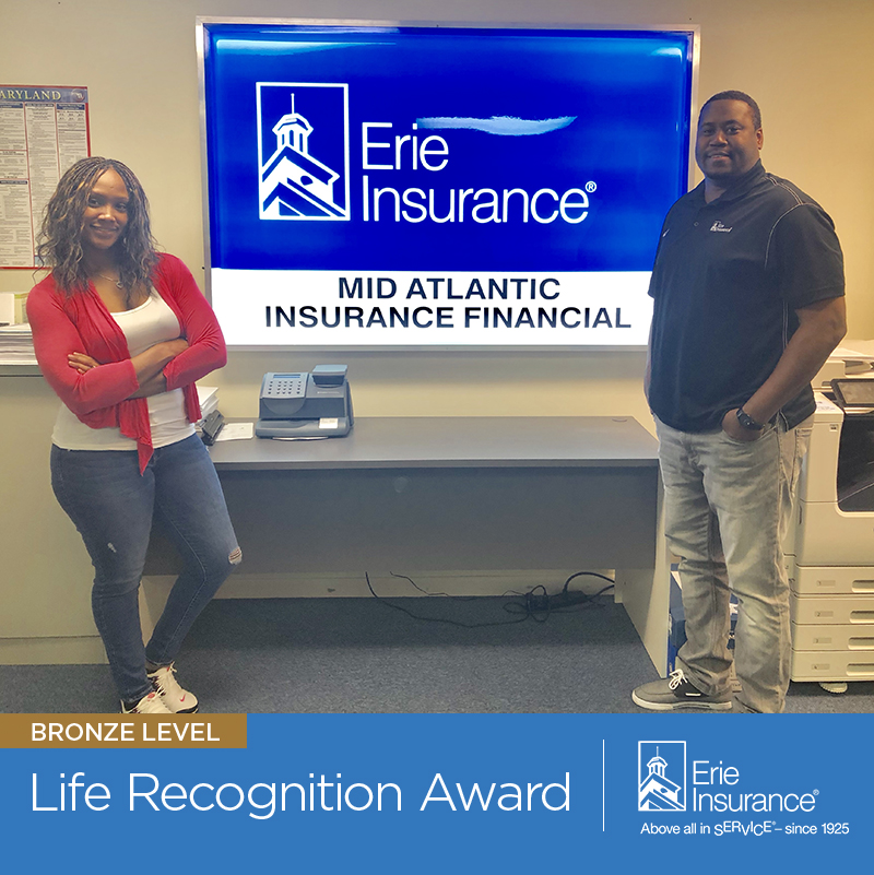 Pictured left to right: Asia Haney, Agent, and Emmett Johnson, Agency Owner.